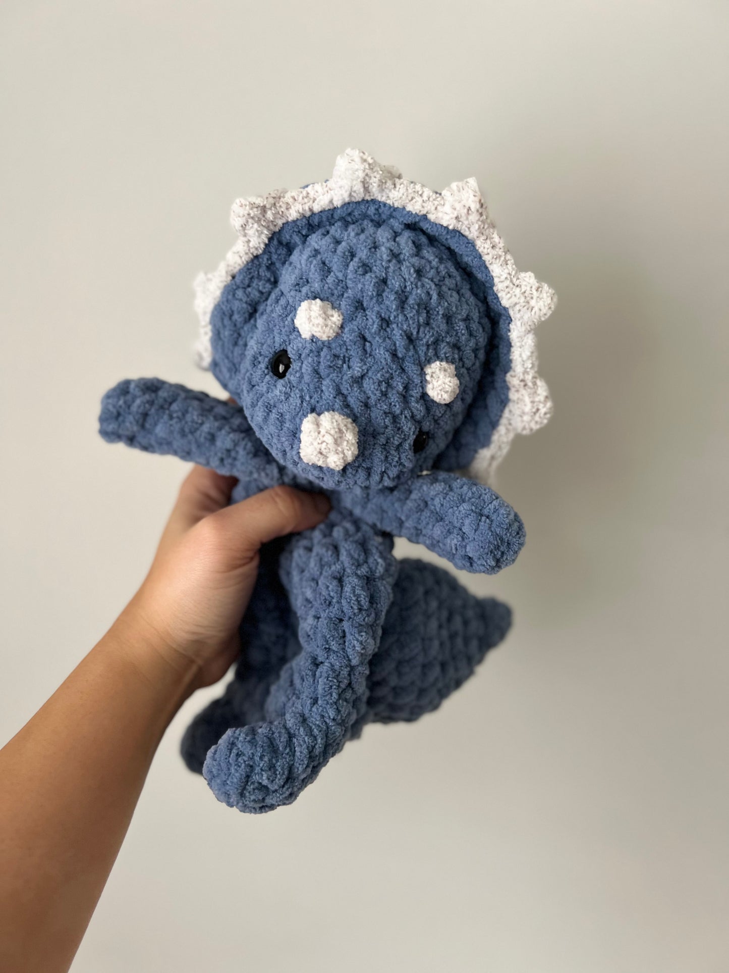 Blue and white triceratops snuggler