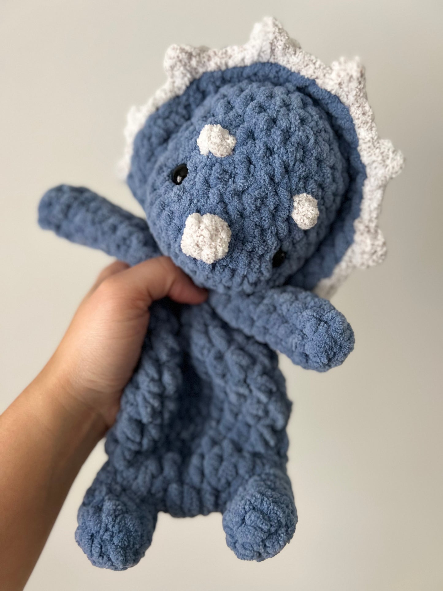 Blue and white triceratops snuggler