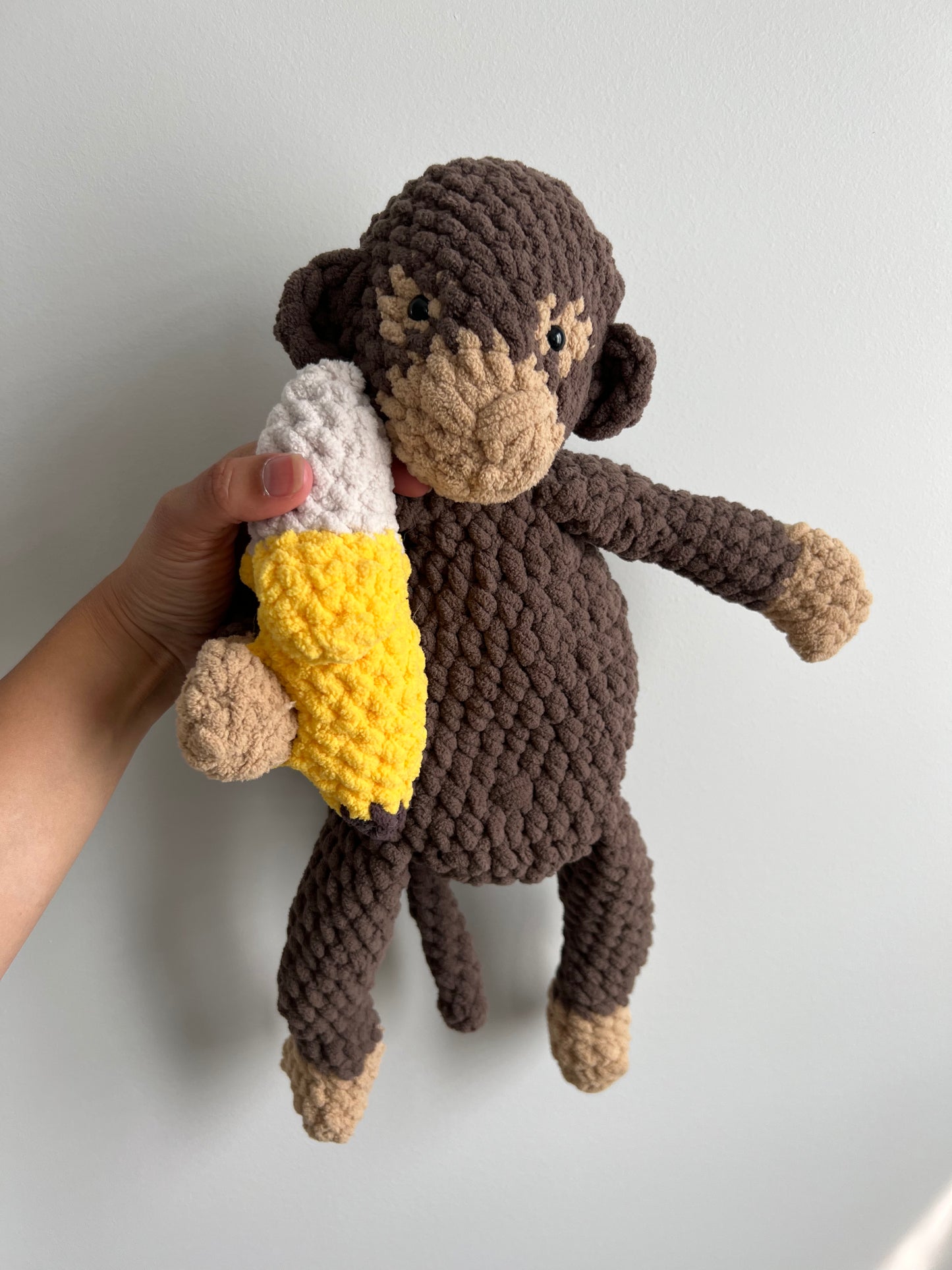 Taupe and sand monkey snuggler with banana